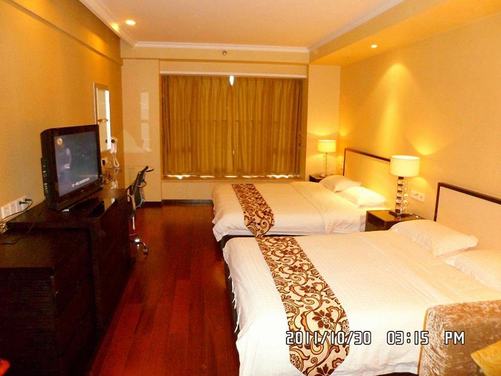 Guangzhou Meiyijia Hotel Apartment Oda fotoğraf